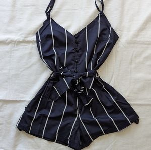 Adorable striped playsuit with removable belt and adjustable straps. Like new.